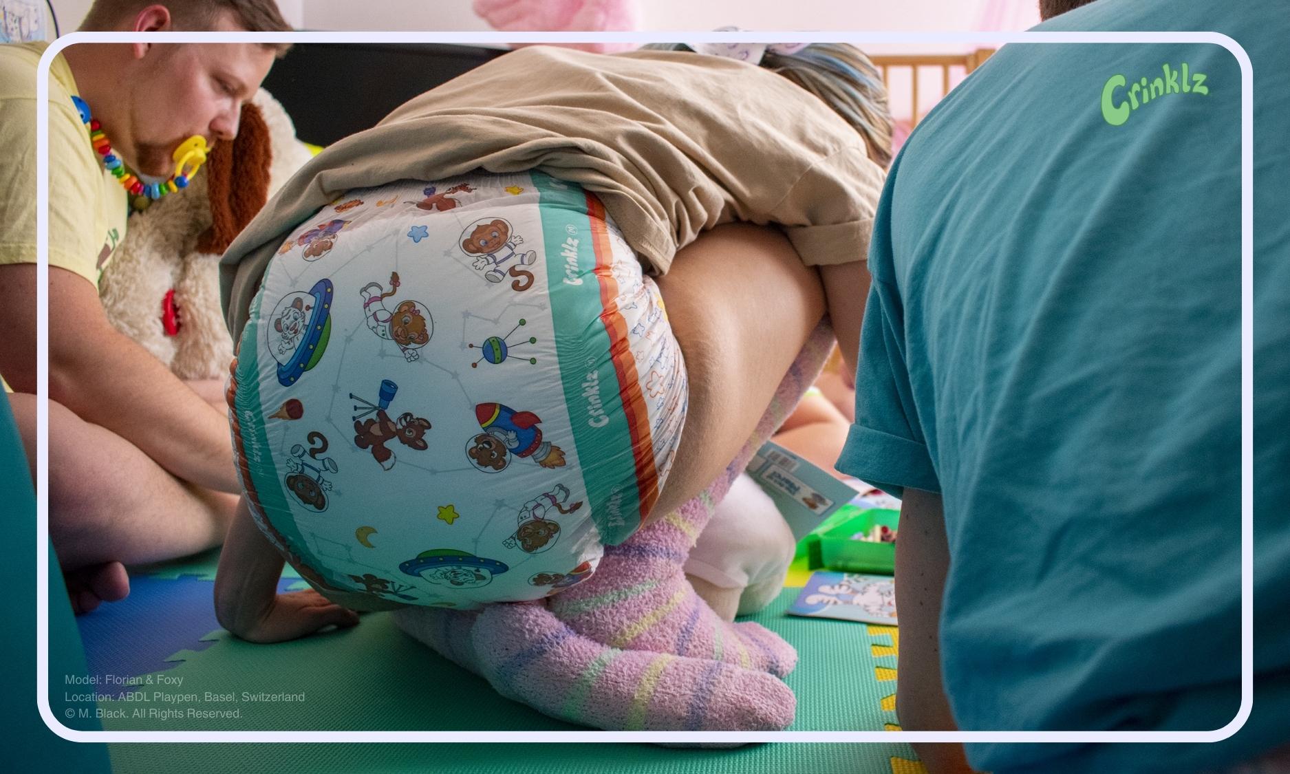 Model wearing Crinklz Astronaut print diapers at ABDL Playpen in Basel Switzerland.