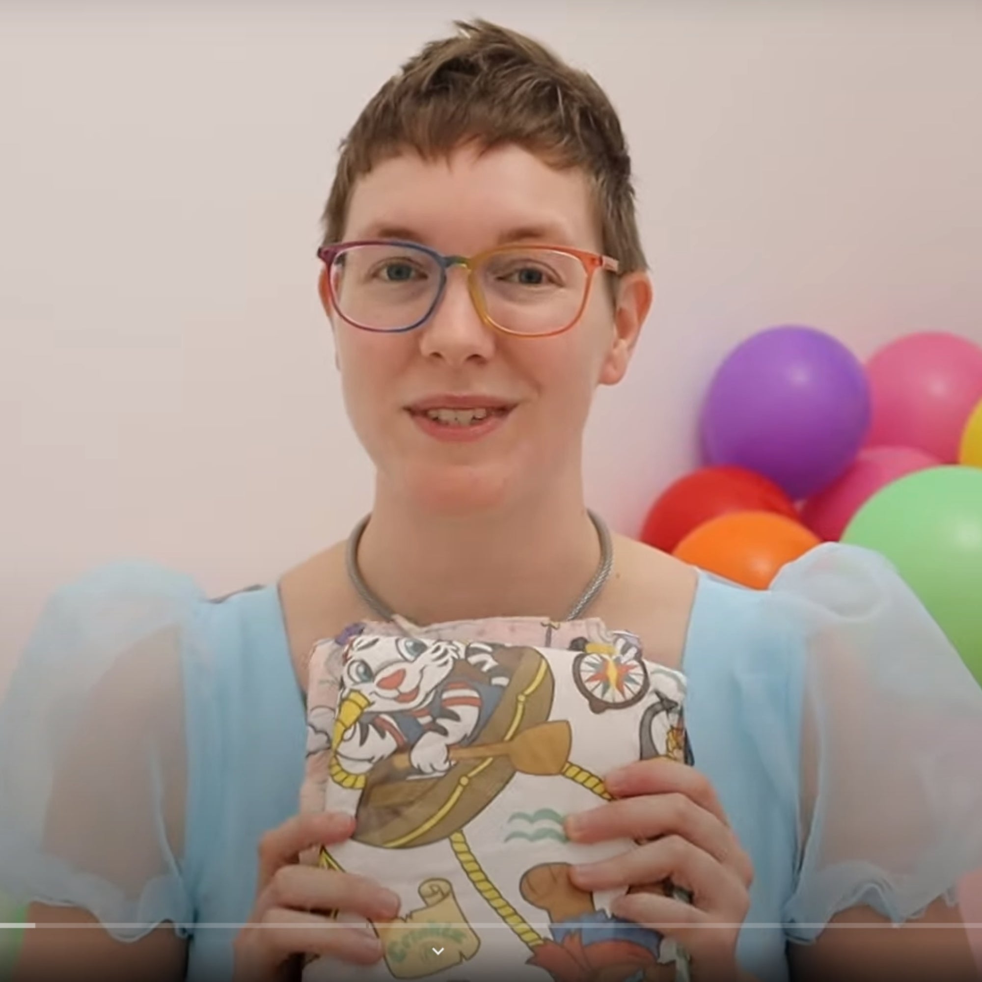 Ada KiGaines holds a Crinklz Buccaneer adult diaper during her review.