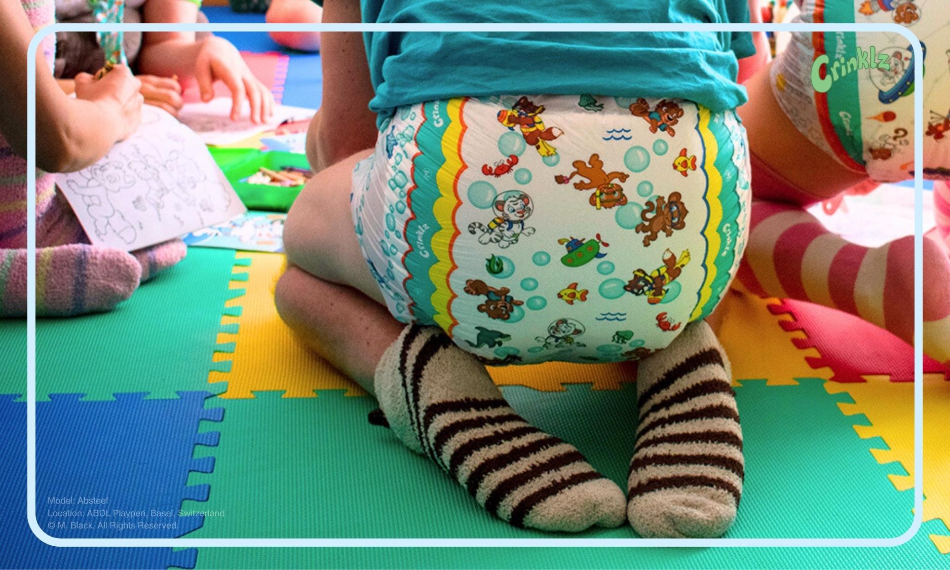 Model wearing Crinklz Aquanaut print adult diapers at ABDL Playpen in Basel, Switzerland.